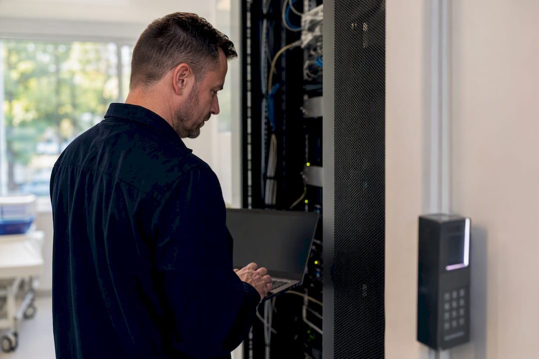 Security auditor inspecting access control hardware