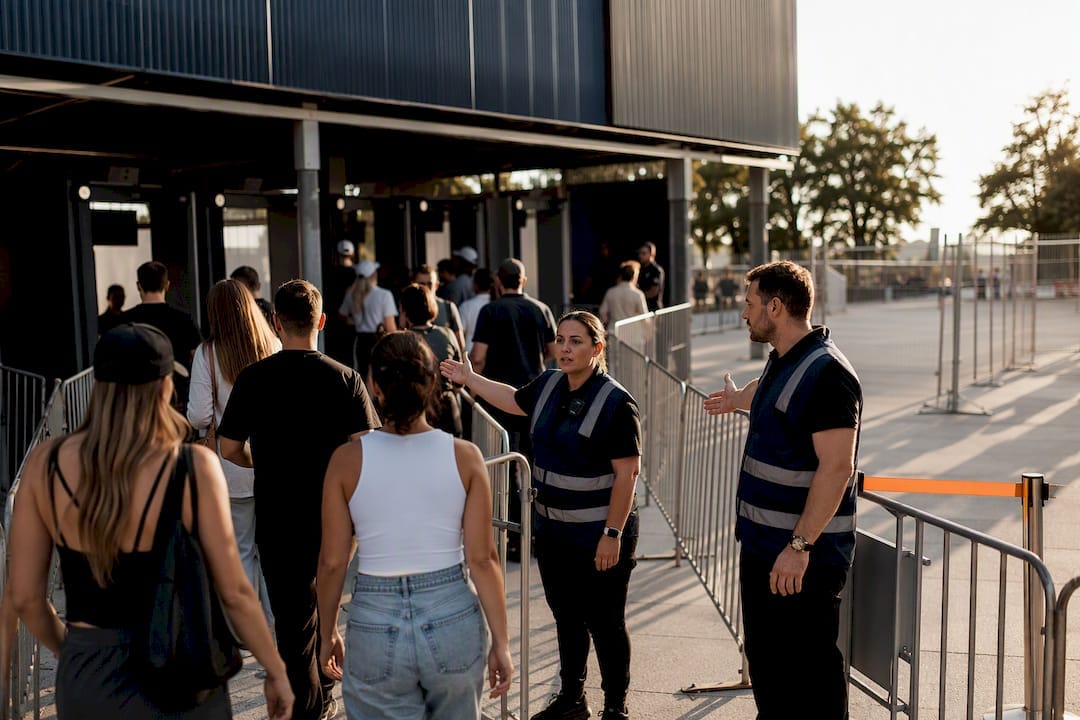 Attendees moving through managed event entry lanes